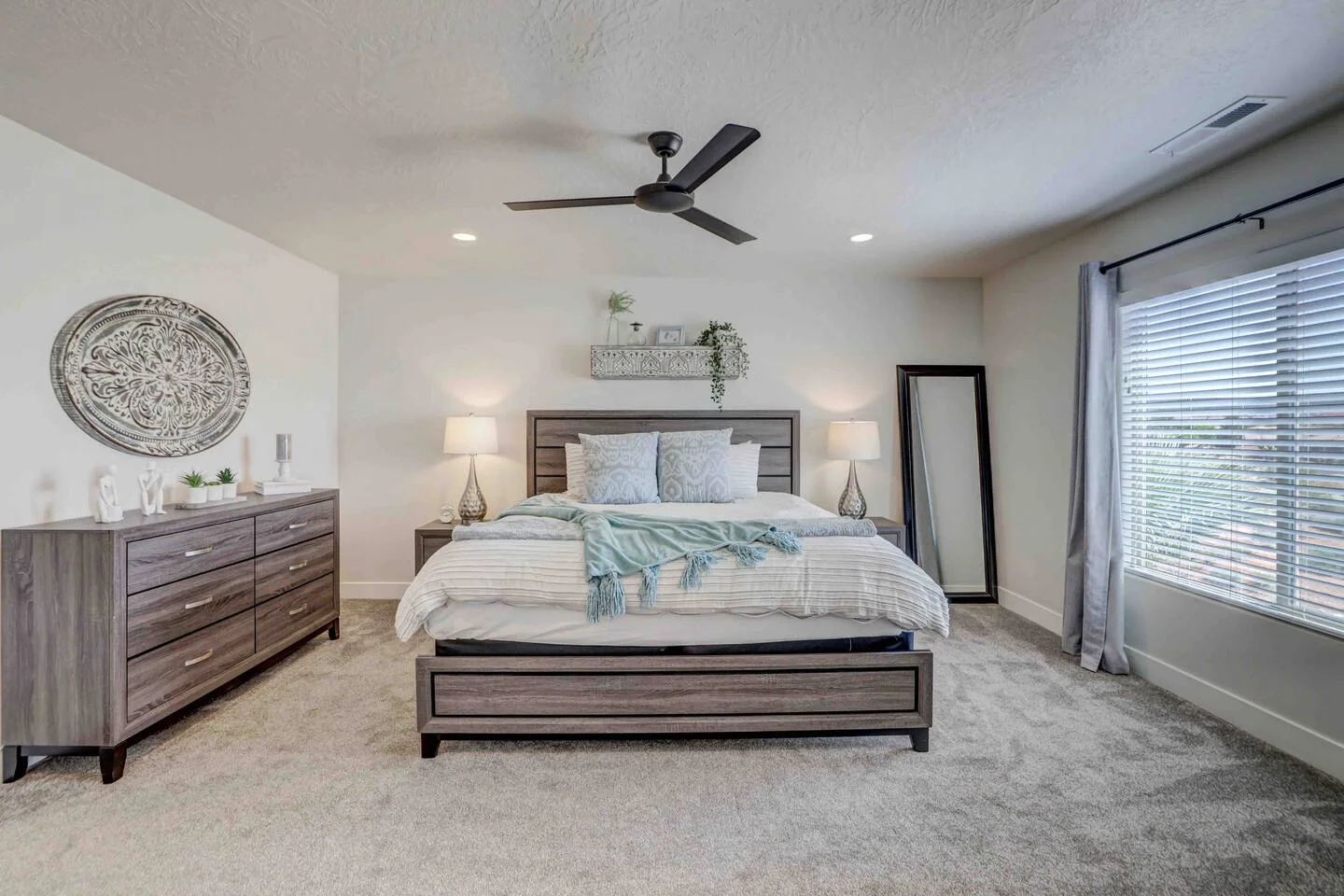 Bright bedroom with a large bed and window